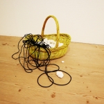 Collection (Negatives of a Touch, Could Be Seashells) and a Black Line, 2024, acrylic, clay, wire, basket.