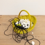 Collection (Negatives of a Touch, Could Be Seashells) and a Black Line, 2024, acrylic, clay, wire, basket. Photo: Paavo Lehtonen.