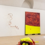 Painting (Dormant State), 2024, acrylic, ink, wood, metal, fabrics, wire, clay, shoes. On the wall: Tummelplatz (Mumbling), 2024, acrylic, wood, fabrics, 200 x 180 x 10 cm. On the left side works by Anna Hyrkkänen. Photo: Paavo Lehtonen.