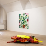Painting (Dormant State), 2024, acrylic, ink, wood, metal, fabrics, wire, clay, shoes. On the wall a painting by Katri Mononen. Photo: Paavo Lehtonen.